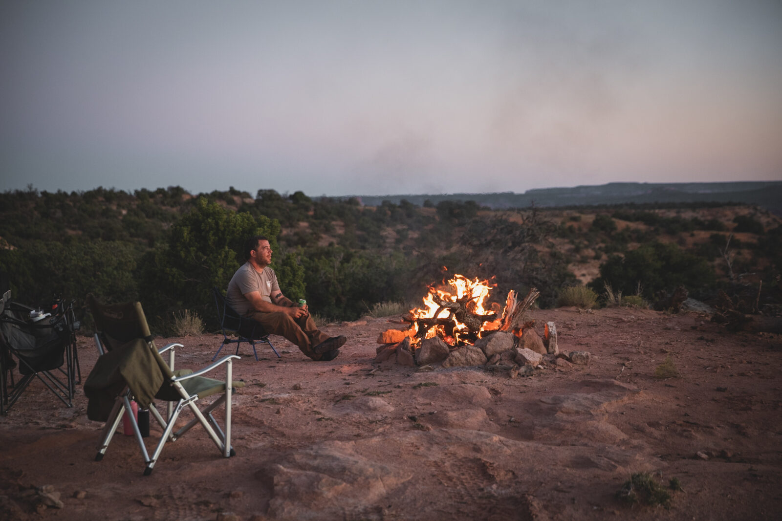 camper with a campfire in a dispersed campsite 