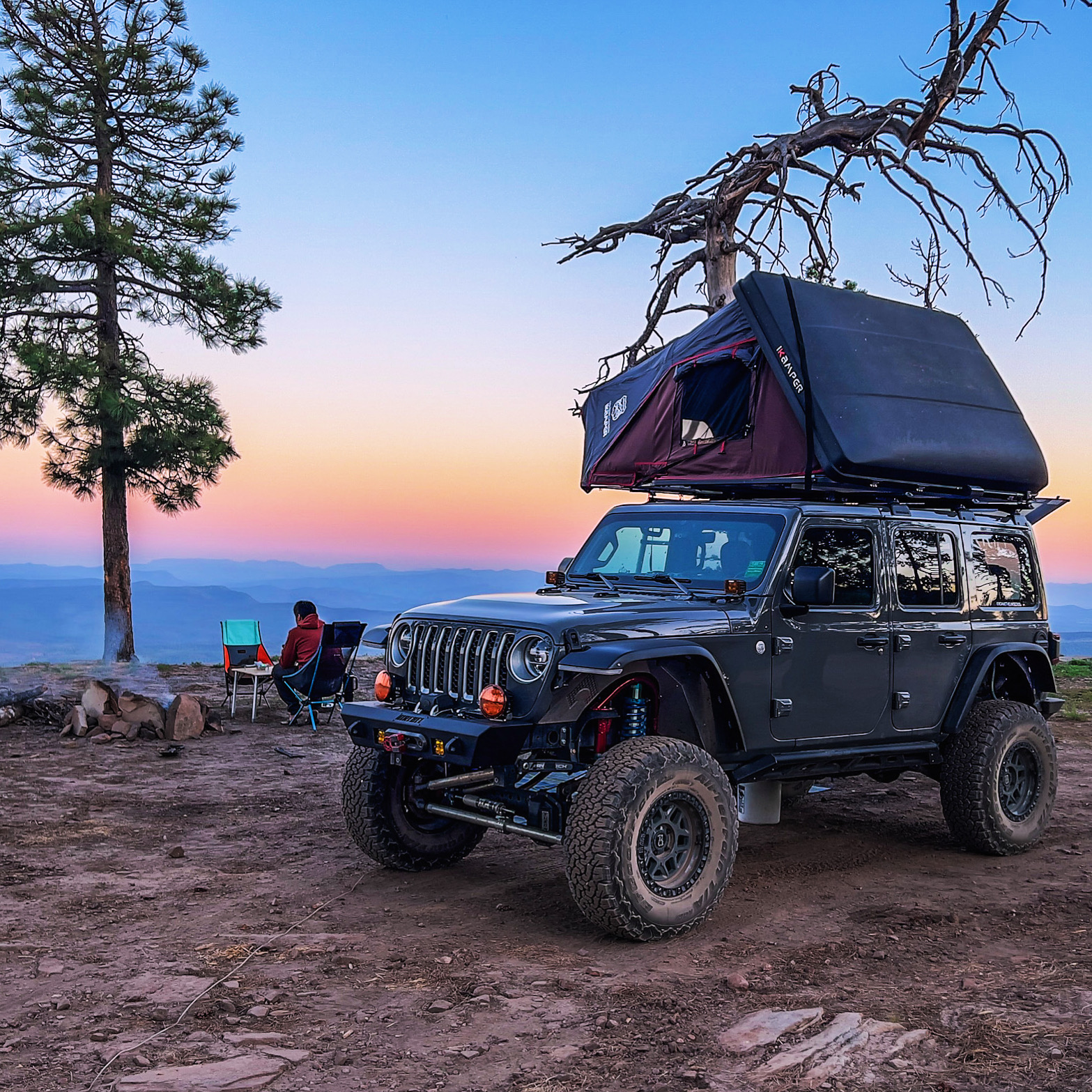 Jeep with overlanding camp gear at a dispersed camp site

