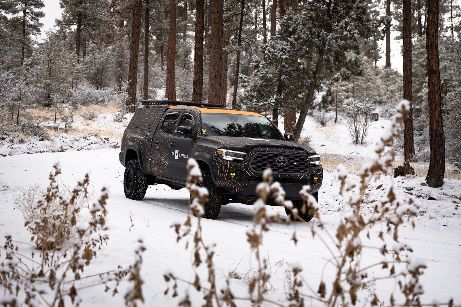 Toyota Tacoma on a snow covered off-road trail 